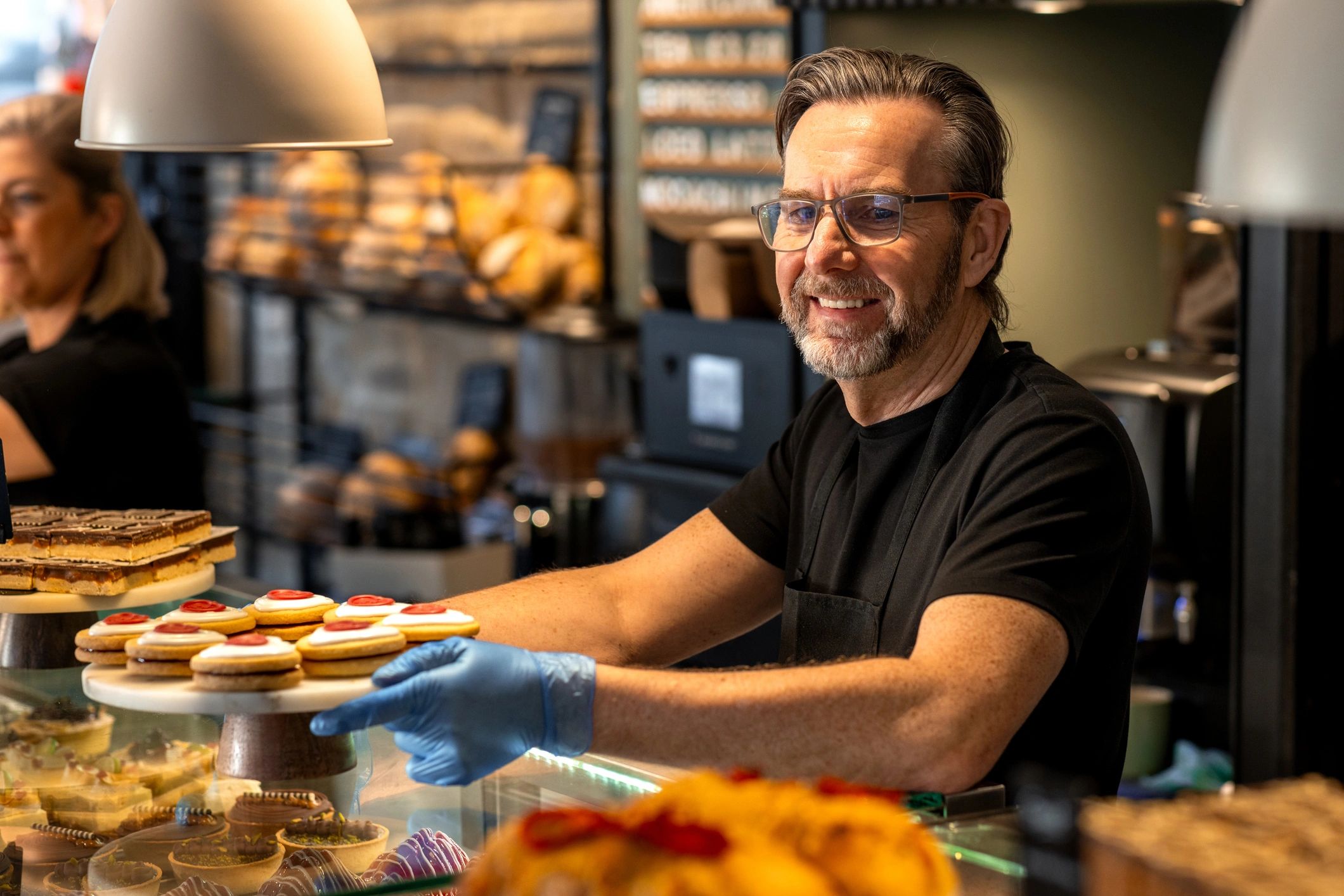 Small-business owner working inside a bakery