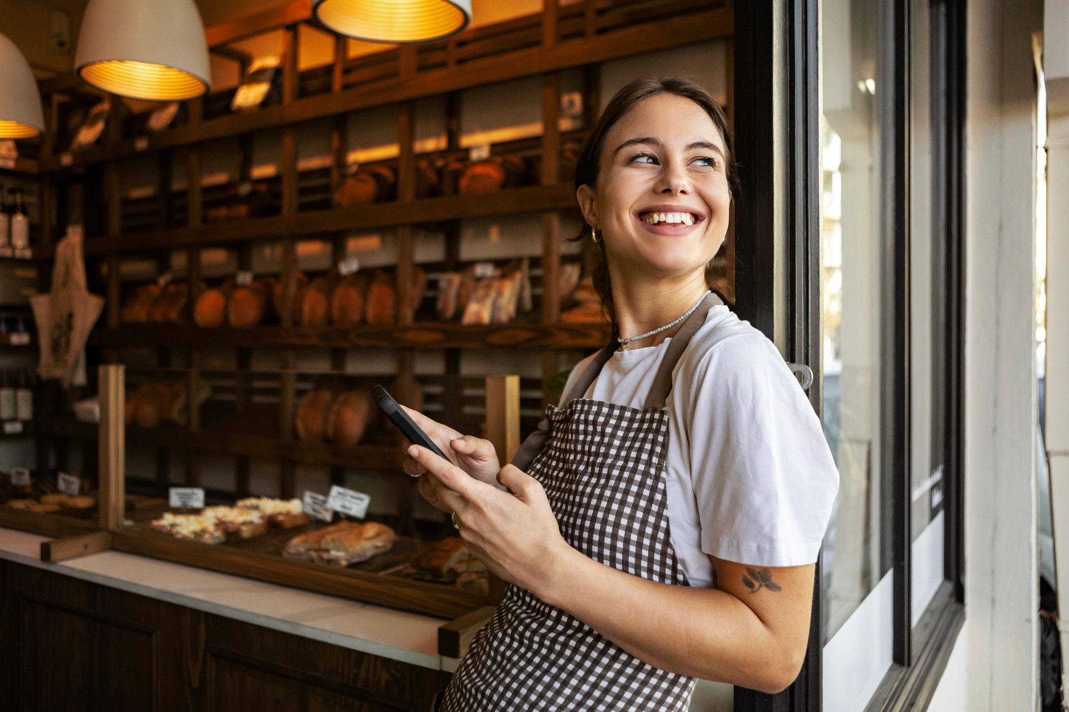 Bakery owner working in a neighborhood shop